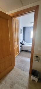 A bed or beds in a room at Xeraco Beach Alma