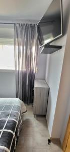 A bed or beds in a room at Xeraco Beach Alma