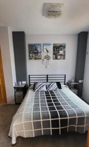 A bed or beds in a room at Xeraco Beach Alma