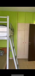 a room with a bunk bed and a locker at Vicky's house in Olympiada