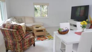 a living room with a couch and a chair at Downtown Hollywood Boutique Hotel in Hollywood