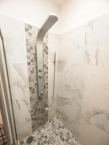 a bathroom with a shower with a glass door at Casa Carola in San Rafael