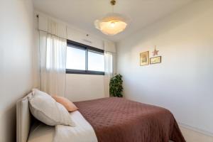 a bedroom with a bed and a window at Le Resort, charmante petite villa d'architecte in Saint-Jean-de-Védas +45 photos