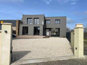 a large house with a driveway in front of it at A 15km du Mont-Saint Michel in Saint-James