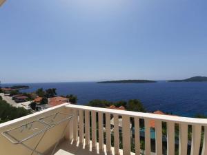a balcony with a view of the water at Vila Mia in Prizba