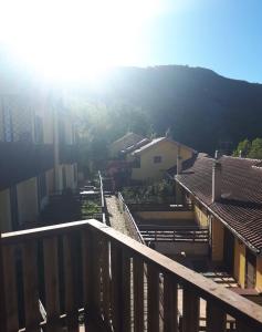 a view from a balcony of a city with houses at RESIDENCE EDELWEISS in Spogna