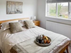 Säng eller sängar i ett rum på Elizabeth Cottage