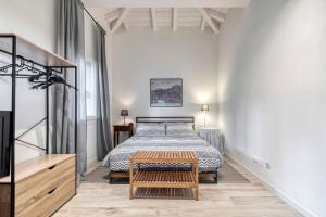 a bedroom with a bed and a table in it at Villa Govi-Pancaldi in San Lazzaro di Savena