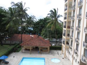 an aerial view of a building and a swimming pool at Bamburi Beach Homes in Bamburi