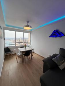 a living room with a table and a couch at Hany apartment Tropic mar 18-C in Benidorm