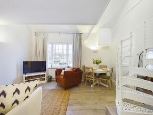 a living room with a couch and a table at “The Sleepers Cottage” 2-6 people w/ free parking in Hough Green