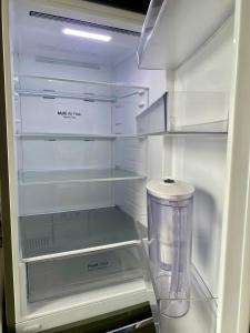 a refrigerator with its door open and a blender in it at Appartement de 3 chambres in Ris-Orangis