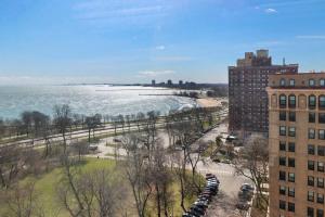 a view of a beach with buildings and a building at Stylish 2BR Retreat in Hyde Park - Shoreland 1320 in Chicago
