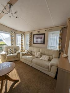 a living room with a couch and two couches at The Ashcroft Sea View 6 in Dunoon +11 photos