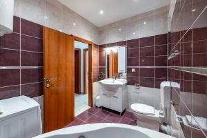 a bathroom with a toilet and a sink at Chill Out - Old Town & Seaview Apartments in Dubrovnik +132 photos