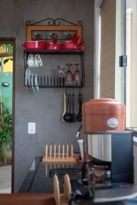 a kitchen with a coffee maker on a counter at Segunda Casa in Paraty