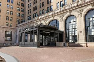 an entrance to a building in a city at Chic & Elite 1BR Apartment in Hyde Park - Shoreland 714 in Chicago