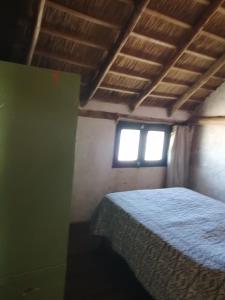 Un pat sau paturi într-o cameră la Paz