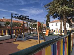 a playground with a swing set in a park at Casa Polícar Marta in Polícar