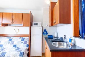 Kuchyňa alebo kuchynka v ubytovaní Appartement Vue Mer - Albatros