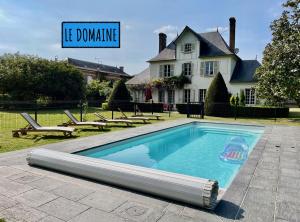 a swimming pool with a sign that reads he dumping at Les gîtes du Champ-De-Bataille in Sainte-Opportune-du-Bosc