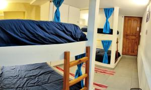 Letto o letti in una camera di Minka Hostel