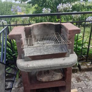 a stone bench sitting on top of a balcony at B&B il boschetto in Ogliastro Cilento