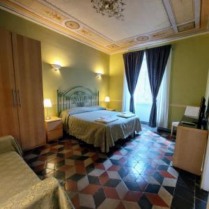 a hotel room with a bed and a room at Residenza Maritti Decò Style- Guesthouse in Rome
