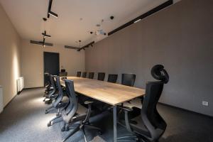 a conference room with a long table and chairs at Almendinger Bolnisi in Bolnisi