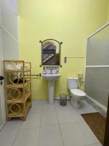 a bathroom with a sink and a toilet at Dar Mora in Tangier