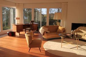 a living room with a couch and a table at Landhuus Stender in Eutin