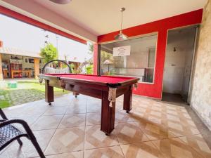 a pool table in the middle of a patio at Casa de Veraneio Villa Lopes in Bonfim