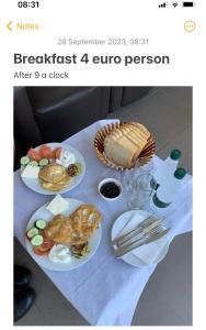 a table with plates of food on top of it at Julton Events Hotel in Domje