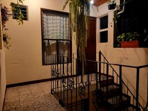 a staircase leading to a house with a window at Casa Jireh Antigua in Antigua Guatemala