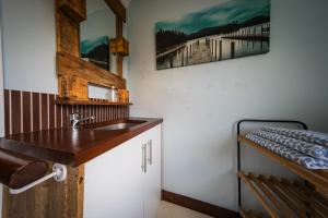 a bathroom with a sink and a bunk bed at 2 Independant Boutique Apartments one sleeps 2 the other sleeps 4, Meadowhall, Sheffield Arena, Free Parking in Sheffield