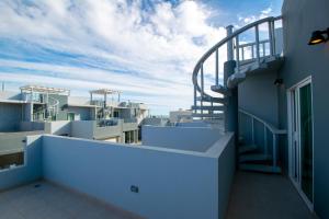 a balcony of a building with a view of the ocean at Residence 35 in Puerto Peñasco