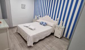 a bedroom with a bed with two pillows on it at Mojácar Vibes 1 Línea de Playa in Mojácar