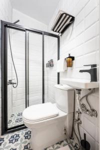 a bathroom with a toilet and a sink and a shower at GALATA FİVE APARTMENTS in Istanbul