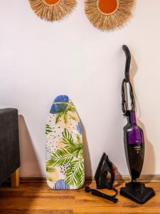 a table with a blow dryer and a surfboard at GALATA FİVE APARTMENTS in Istanbul