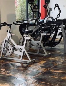 a gym with two treadmills and elliptical machines at Just like home Vacation in Ocho Rios
