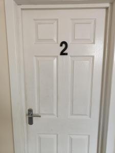 a white door with the number two on it at The Hagley Rose - Birmingham in Birmingham