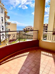 an apartment balcony with a view of the ocean at Casa Vacanze La Baia in Messina