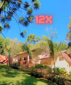 an image of a house with a yard at Pousada Villa Bergamin in Monte Verde