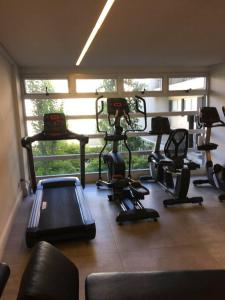 a gym with a bunch of exercise equipment in a room at Excelente estudio premium con amenities in Buenos Aires