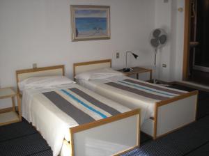 Postel nebo postele na pokoji v ubytování Doge Inn