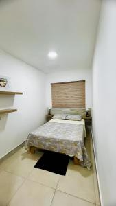 Postel nebo postele na pokoji v ubytování BELLA STONIA RESIDENCE LA ROMANA
