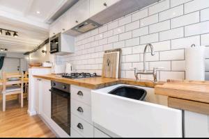 a kitchen with a sink and a counter top at The Cwtch in Brecon