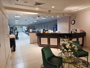 a salon with a waiting room with chairs and a counter at Attractive Modern Unit by Flamingo Strip Las Vegas in Las Vegas