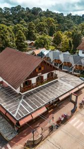 an overhead view of a train station with a building at Pousada Avenida in Monte Verde