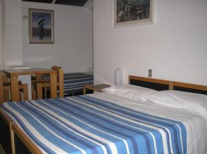Postel nebo postele na pokoji v ubytování Doge Inn